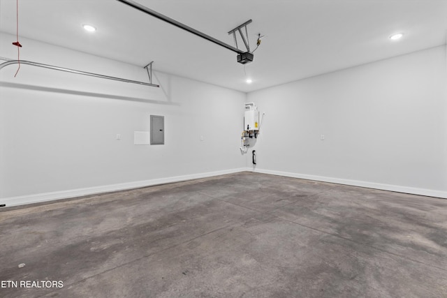 garage with recessed lighting, a garage door opener, and electric panel