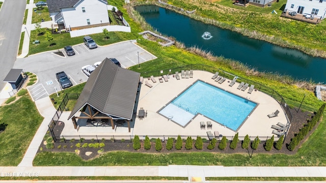 birds eye view of property with a water view
