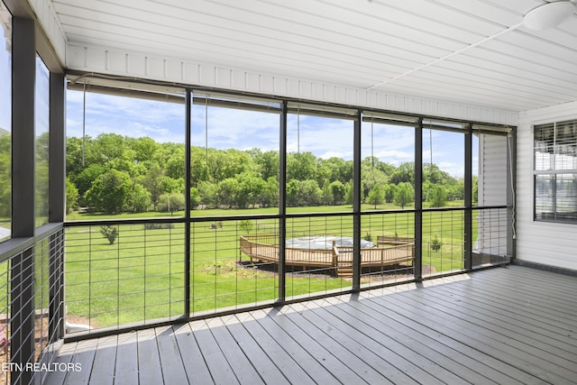 unfurnished sunroom featuring a healthy amount of sunlight