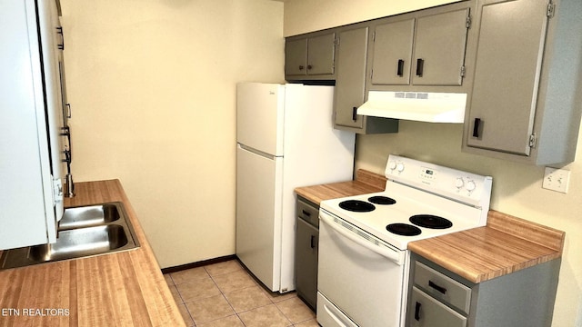 7003 Old Clinton Pike, Knoxville, TN 37921 - kitchen with ventilation hood, white appliances, light countertops, gray cabinets, and light tile patterned floors