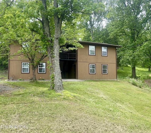 7003 Old Clinton Pike, Knoxville, TN 37921 - rear view of property featuring a yard
