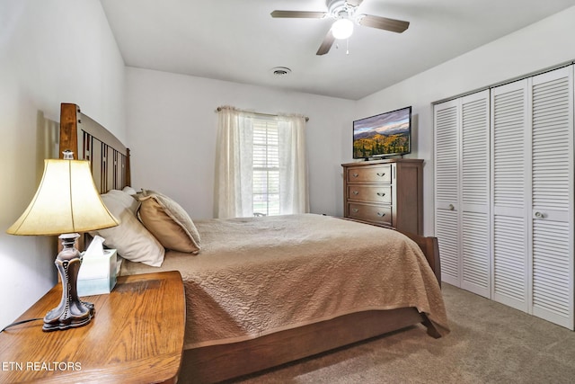 bedroom featuring ceiling fan, carpet, a closet, and visible vents
