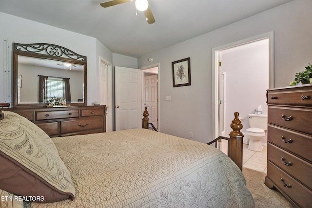 bedroom with ceiling fan and ensuite bath