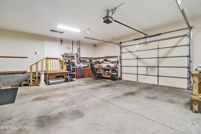garage featuring a garage door opener