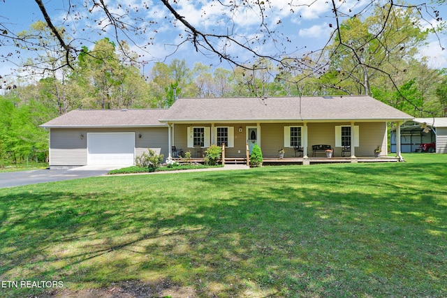 ranch-style home featuring a porch, driveway, a front yard, and a garage