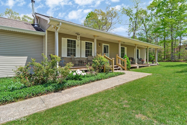 ranch-style home with a porch and a front yard