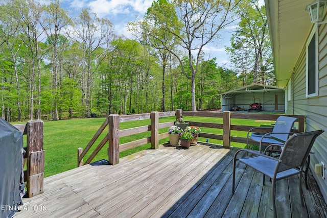 wooden deck with a lawn and a carport