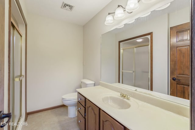 bathroom with vanity, toilet, tile patterned floors, visible vents, and a stall shower