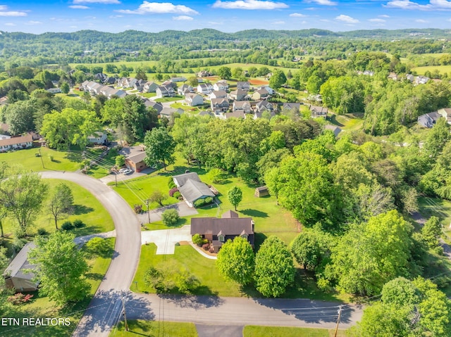 aerial view featuring a residential view and a view of trees