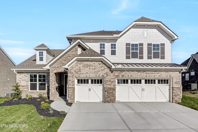 12783 Iron Plow Dr, Knoxville, TN 37934 - view of front of house featuring driveway, roof with shingles, central AC unit, and stone siding