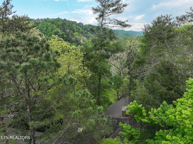 exterior space with a view of trees