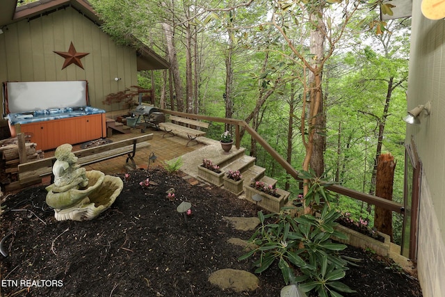 exterior space with a hot tub