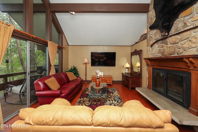 living room with beamed ceiling, a fireplace, high vaulted ceiling, and wood finished floors