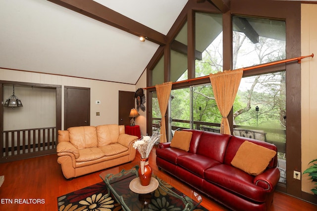 living area with wood finished floors, high vaulted ceiling, and beamed ceiling