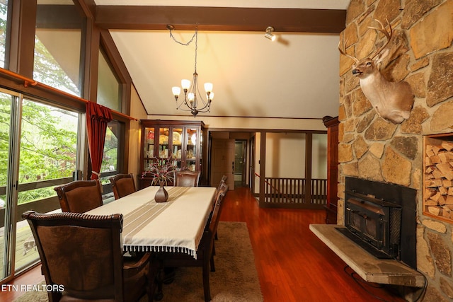 dining room featuring high vaulted ceiling, a chandelier, and wood finished floors