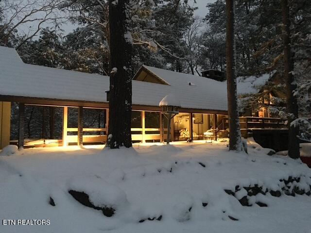 view of snow covered house