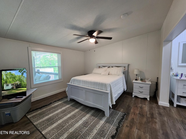 bedroom with dark wood-type flooring and ceiling fan