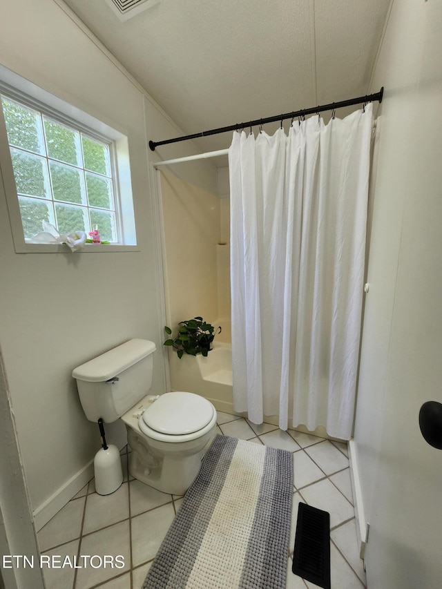 full bathroom with tile patterned flooring, shower / bath combo with shower curtain, toilet, and visible vents