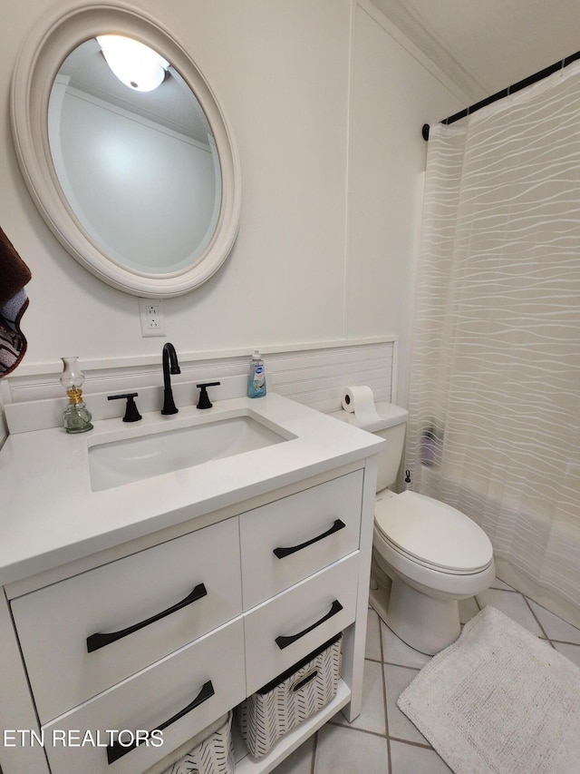 bathroom with toilet, tile patterned floors, a shower with curtain, and vanity