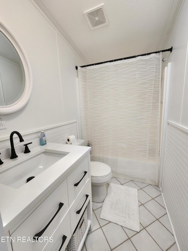 full bathroom with visible vents, crown molding, tile patterned flooring, vanity, and toilet