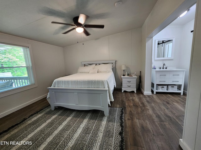 bedroom with a sink, ceiling fan, and dark wood-style flooring