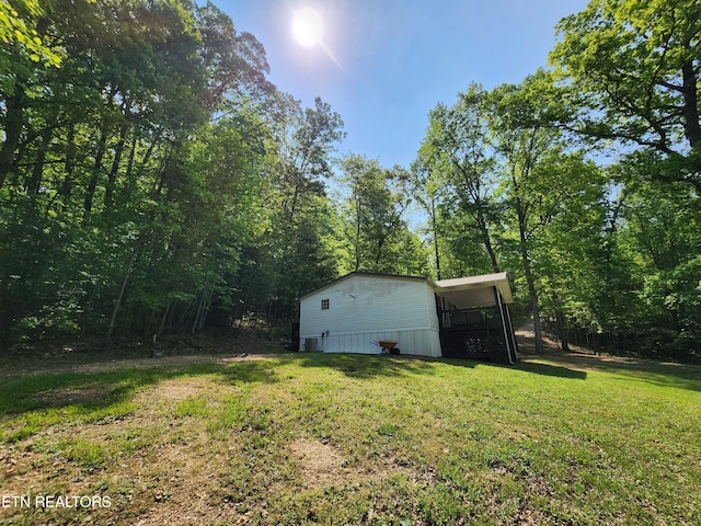 view of yard with a wooded view