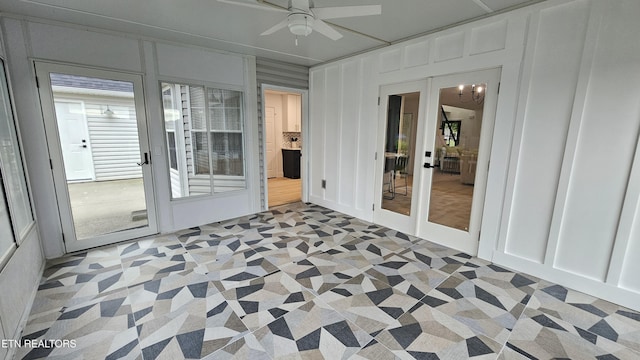 unfurnished sunroom with french doors