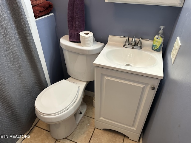 full bath with vanity, tile patterned floors, and toilet