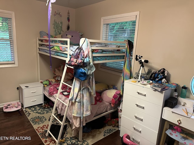 bedroom with wood finished floors