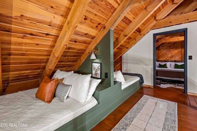 bedroom with wooden ceiling, wood finished floors, baseboards, and vaulted ceiling with beams