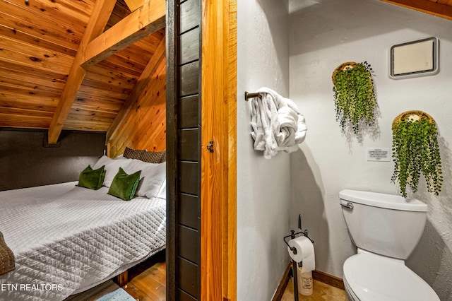 bedroom featuring beam ceiling and wood ceiling