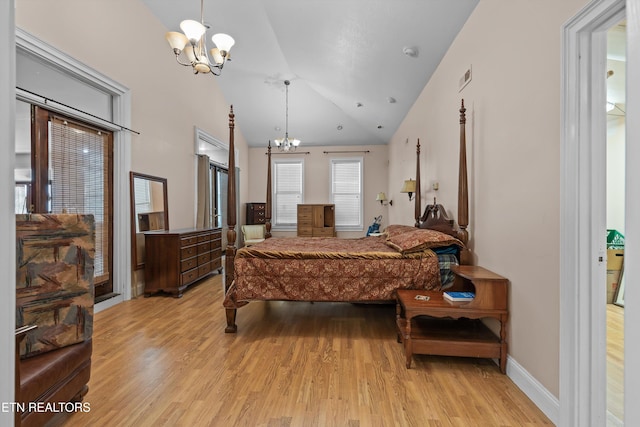 702 Meadowview Dr, Harriman, TN 37748 - bedroom with visible vents, lofted ceiling, baseboards, light wood-type flooring, and a chandelier