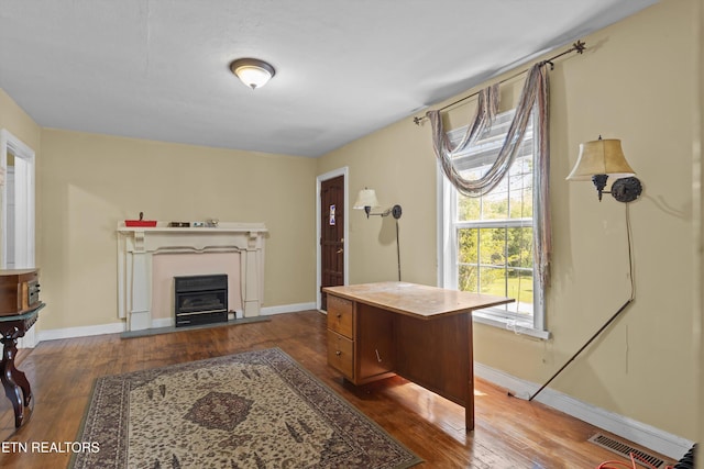 702 Meadowview Dr, Harriman, TN 37748 - office area with wood-type flooring, baseboards, and a glass covered fireplace
