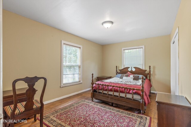 702 Meadowview Dr, Harriman, TN 37748 - bedroom featuring baseboards and wood finished floors