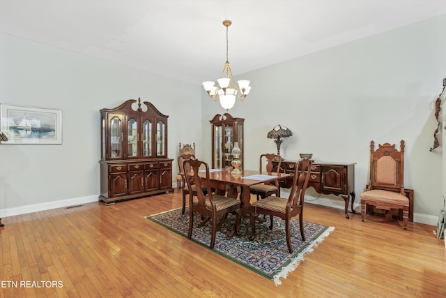 702 Meadowview Dr, Harriman, TN 37748 - dining area featuring visible vents, light wood-style flooring, baseboards, and a chandelier