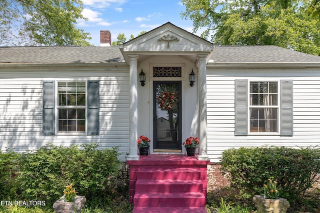 702 Meadowview Dr, Harriman, TN 37748 - property entrance featuring a shingled roof and a chimney