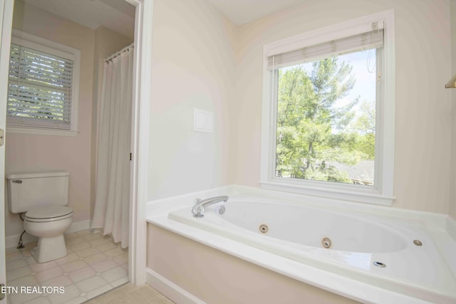 full bath with a tub with jets and toilet