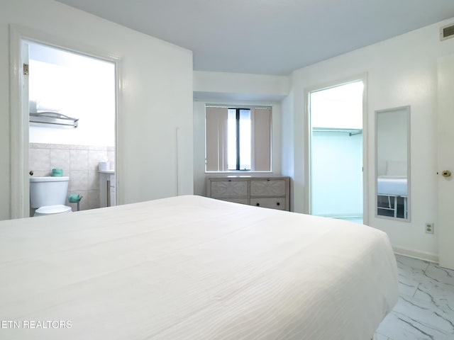 bedroom featuring marble finish floor and visible vents