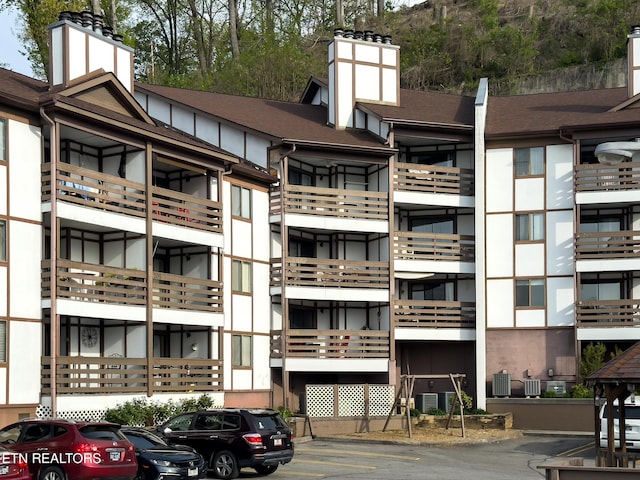 view of property with uncovered parking