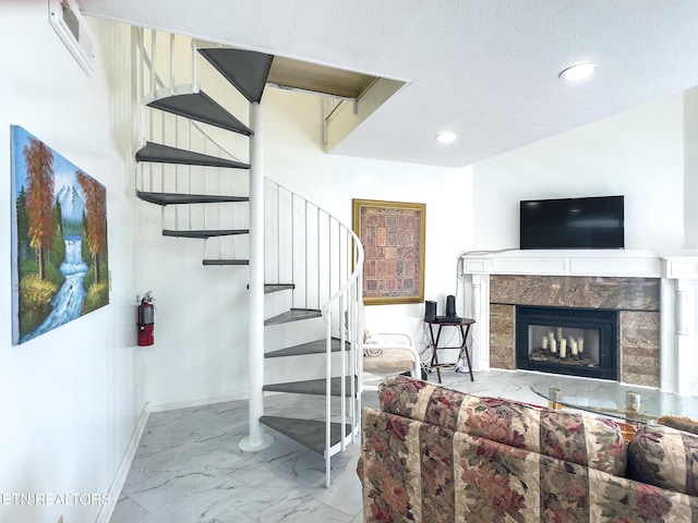 stairway featuring visible vents, marble finish floor, baseboards, and recessed lighting