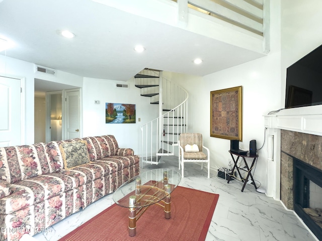 living room featuring marble finish floor, stairs, visible vents, and recessed lighting