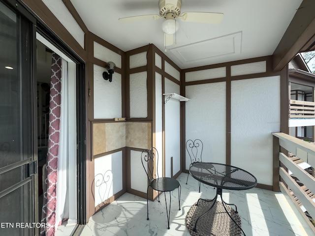 balcony featuring a ceiling fan