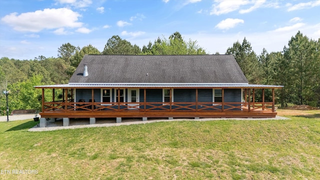 487 Fish Hatchery Rd, Sweetwater, TN 37874 - back of house with a yard, metal roof, and a view of trees