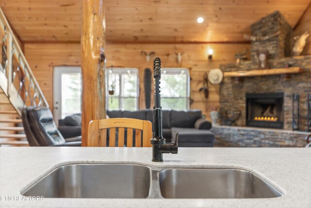 487 Fish Hatchery Rd, Sweetwater, TN 37874 - kitchen with wood ceiling, wooden walls, a fireplace, open floor plan, and a sink