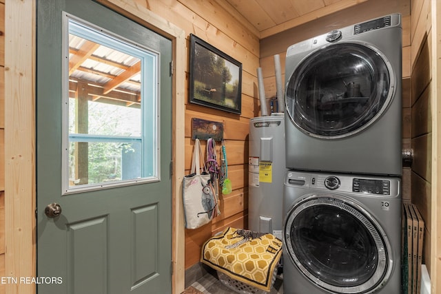 487 Fish Hatchery Rd, Sweetwater, TN 37874 - laundry room featuring water heater, stacked washer / drying machine, wood ceiling, and wooden walls