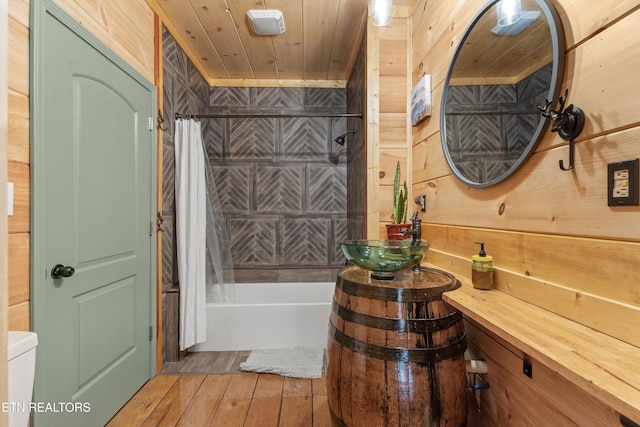 487 Fish Hatchery Rd, Sweetwater, TN 37874 - full bathroom featuring hardwood / wood-style floors, shower / bathtub combination with curtain, wood ceiling, wood walls, and vanity
