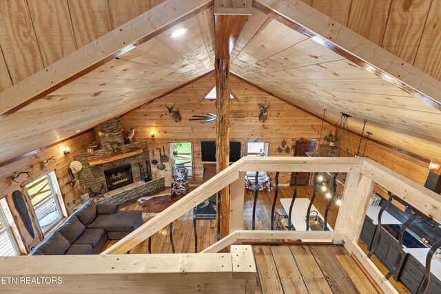 487 Fish Hatchery Rd, Sweetwater, TN 37874 - unfurnished living room with wood walls, lofted ceiling, a fireplace, hardwood / wood-style floors, and wooden ceiling