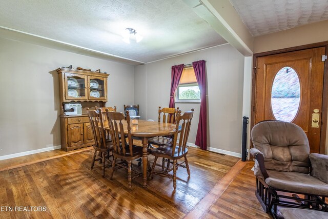 172 W Hills Rd, Rutledge, TN 37861 - dining space featuring wood finished floors, baseboards, and a textured ceiling