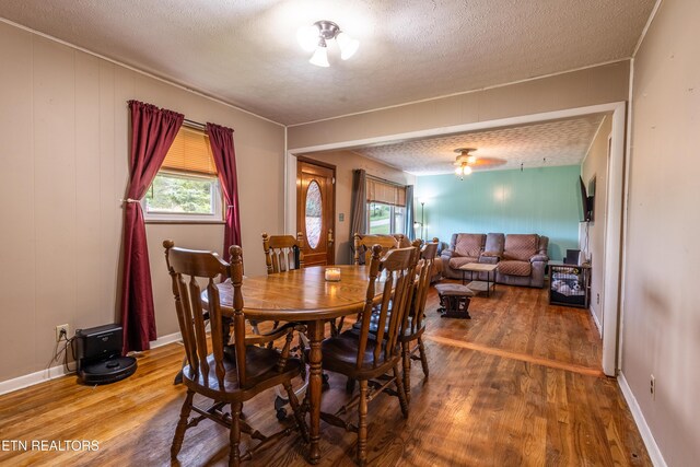 172 W Hills Rd, Rutledge, TN 37861 - dining area with wood finished floors, plenty of natural light, and a textured ceiling