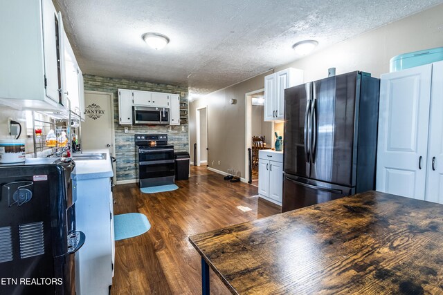 172 W Hills Rd, Rutledge, TN 37861 - kitchen with appliances with stainless steel finishes, a textured ceiling, white cabinets, dark wood-type flooring, and light countertops